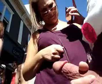 Girl touching clothed cock